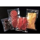 A collection of 3mil Clear Vacuum Bags filled with various food items, including sliced salami, raw steak, shredded cheese, and dried meat, showcasing airtight sealing for freshness and preservation.