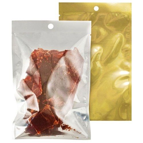 A 5mil Clear/3mil Metallized Silver Zipper Vacuum Bag w/ Hang Hole containing dried meat, featuring a transparent front for product visibility and a metallic silver backing for enhanced presentation and light protection.