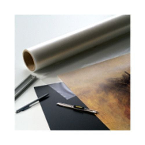 A roll of Drytac Dry Mount Film Mounting Tissue alongside cutting tools and a partially mounted print.