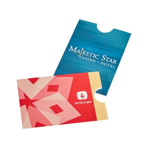 Two Custom Gift Card & Key Card Holders are displayed, one with a blue gradient design for "Majestic Star Casino & Hotel" and another with a red geometric pattern for "Larkburger," both featuring a notch cutout for easy card access.