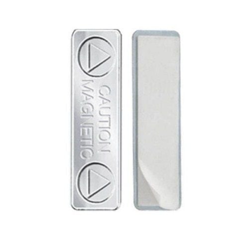 Two silver MAGNABADGE Magnetic Badge Findings, one with engraved "CAUTION MAGNETIC" text and symbols, and the other showing a smooth adhesive backing.