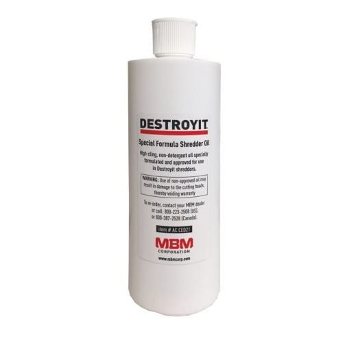 A bottle of MBM DestroyIt Shredder Oil designed for lubricating and maintaining shredder performance.
