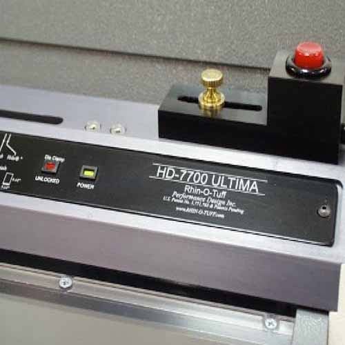 The Rhin-O-Tuff Palm Switch for HD7000/7700 Punch, showcasing the control panel with a red emergency stop button and brass knob.