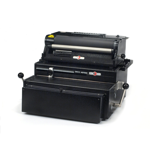 A Rhin-O-Tuff 7700C4 Mega Duty Electric Coil Binding System, a heavy-duty machine designed for efficient coil binding tasks.