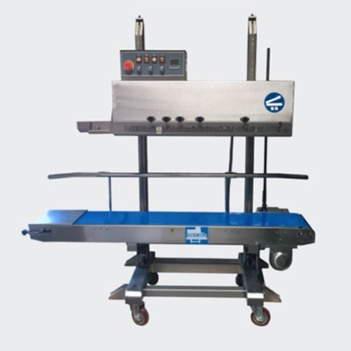 SealerSales FRM-1120LD Left Feed Vertical Dry Ink Coding Continuous Band Sealer featuring a stainless steel body, control panel with buttons and knobs, and a blue conveyor belt on adjustable wheeled legs.