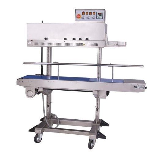 A compact SealerSales FRM-1120LD Right Feed Vertical Dry Ink Coding Continuous Band Sealer with a stainless steel frame, blue conveyor belt, caster wheels, and a top-mounted control panel featuring indicator lights and adjustment knobs.