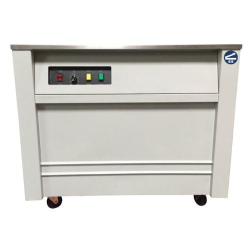 A white SealerSales SM-101 Semi-Automatic Strapping Machine with a flat stainless steel top, control panel featuring indicator lights and switches, and mounted on wheels for mobility.