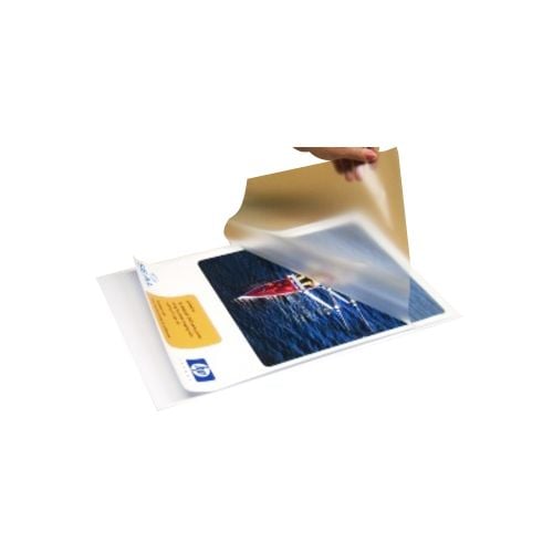 A hand is peeling back a clear film from a White Corrugated Plastic Laminating Pouch Board, showcasing a laminated printed photo underneath.