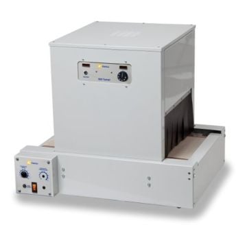 A Clamco Model 820MB Shrink Tunnel and Accessories featuring a compact, industrial design with control knobs, indicator lights, and a conveyor system for heat-sealing applications.