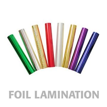 An assortment of colorful 12" x 100' Metallic Laminating Foil rolls in green, silver, gold, red, white, and purple shades arranged in a semi-circle.