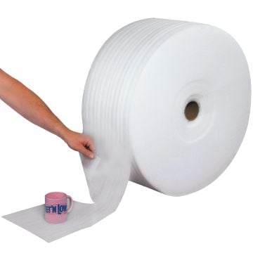 A Parcel Ready Perforated Air Foam Roll is shown dispensing pre-cut foam sheets, with a person tearing off a section to wrap around a fragile pink coffee mug for protective cushioning.
