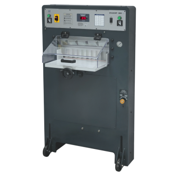 Shows a Challenge CHAMP 185 Manual w/ Tilt Shield 18.5" Hydraulic Paper Cutter, featuring a protective shield, adjustable controls, and a manual handwheel for precise paper cutting.