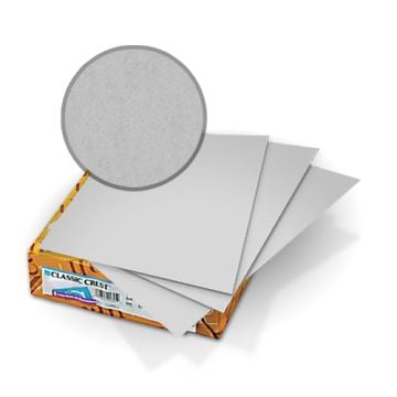 Stack of Classic Crest Whitestone 80lb Covers showing smooth, light gray paper sheets.