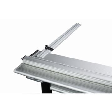 The Keencut 36" Extended Measuring Arm for Sabre Series 2 is shown mounted on a cutting table, featuring a sleek aluminum design with a precision measurement guide and a black adjustment knob.