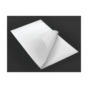 A white GBC Laminating Pouch Carrier with one corner partially folded back, displayed against a dark background.