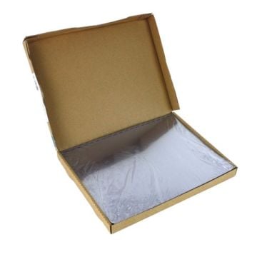 An open brown cardboard box containing GBC Premium Copolyester 9mil 8.5" x 11" Comb Punched Covers, 100-pack, with a transparent plastic cover inside.