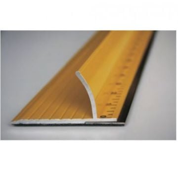 A close-up view of an aluminum Ultra Safety Ruler/Straight Edge featuring a raised protective edge and measurement markings on a yellow surface.
