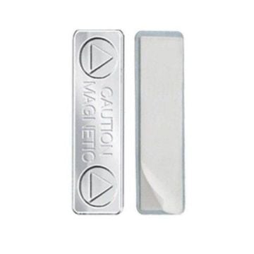 Two silver MAGNABADGE Magnetic Badge Findings, one with engraved "CAUTION MAGNETIC" text and symbols, and the other showing a smooth adhesive backing.