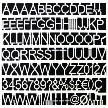 An assortment of 'MasterVision 1' White Plastic Interchangeable Characters arranged neatly on a black background, featuring letters, numbers, and symbols.