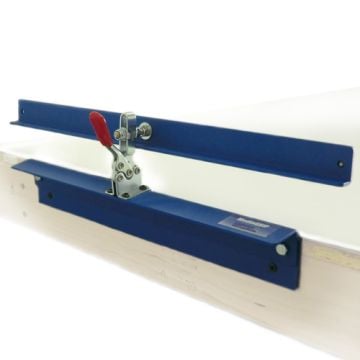 Clamp used in a setup for precise alignment of 3" x 5" Photo Size Sticky Back Laminating Pouches.