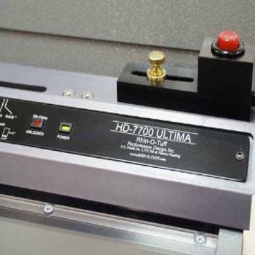 The Rhin-O-Tuff Palm Switch for HD7000/7700 Punch, showcasing the control panel with a red emergency stop button and brass knob.