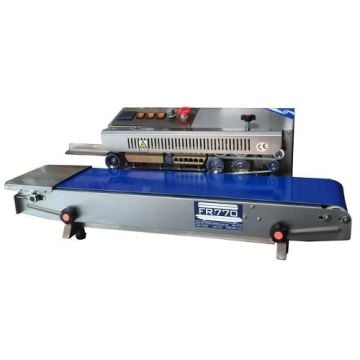 SealerSales FR-770I Horizontal Continuous Band Sealer (Left Feed) with a stainless steel body and blue conveyor belt, designed for efficient heat sealing, featuring control buttons, a red emergency stop button, and a compact design.