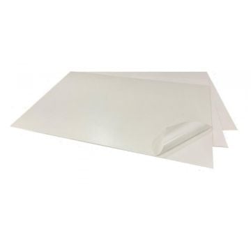 Two sheets of white Self-Stick 1/8" Corrugated Graphic Boards with Recyclable Adhesive, featuring a visible peeling corner that highlights the adhesive backing.