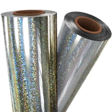 Rolls of Silver Glitter Laminating / Toner Fusing Foil with a sparkling holographic finish, perfect for adding a dazzling touch to projects.