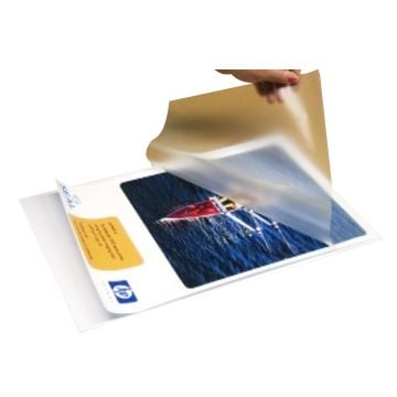 A hand is peeling back a clear film from a White Corrugated Plastic Laminating Pouch Board, showcasing a laminated printed photo underneath.