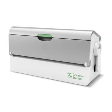 Xyron 9" Creative Station Laminator with 5" Option, featuring a compact design and dual-function laminating capabilities.