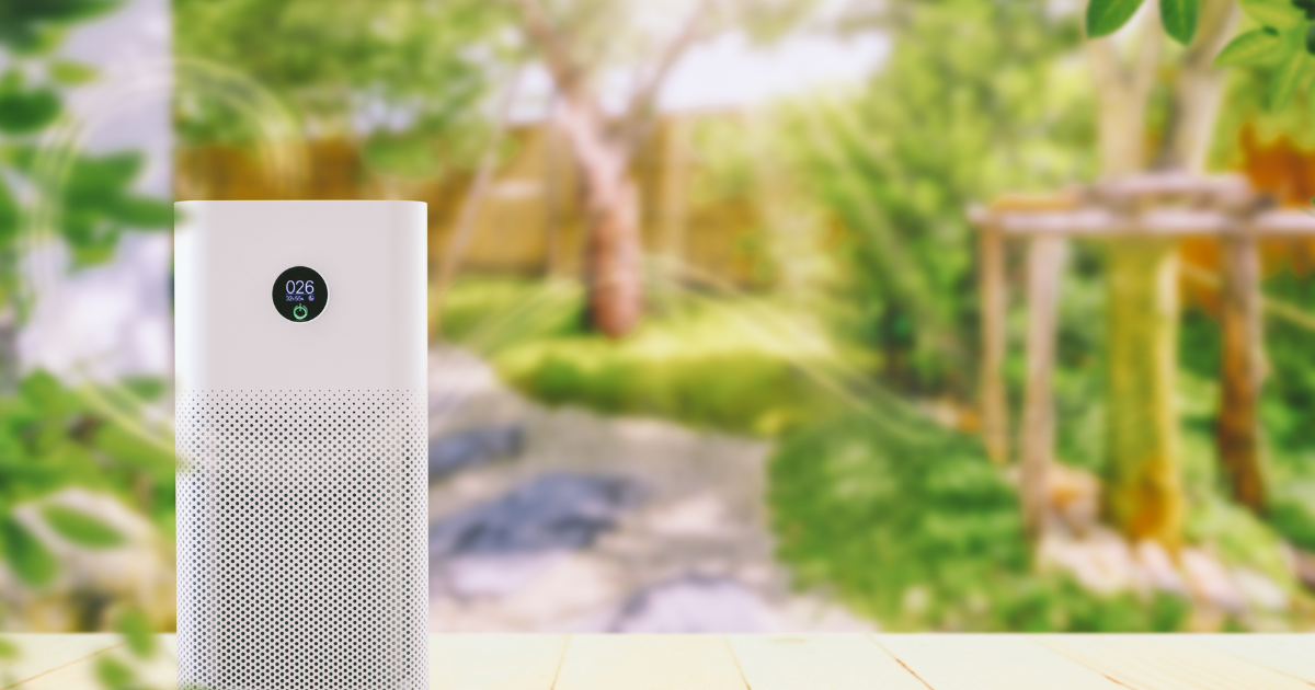An air purifier positioned by the window, effectively purifying the surrounding air.